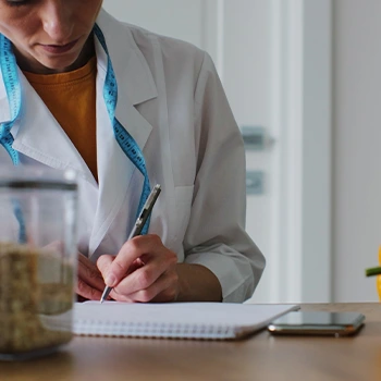 woman with a pen and notebook