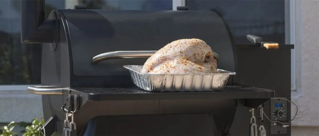 whole chicken on a vertical pellet smoker