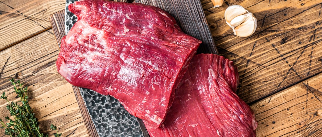 Flank steak on a cutting board