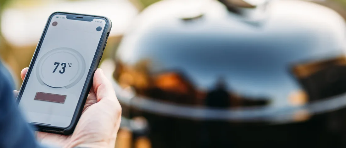 Man holding digital thermometer