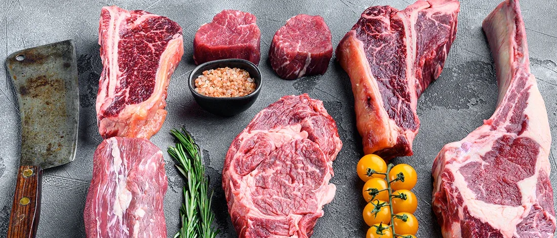 Different cuts of bison meat on a table