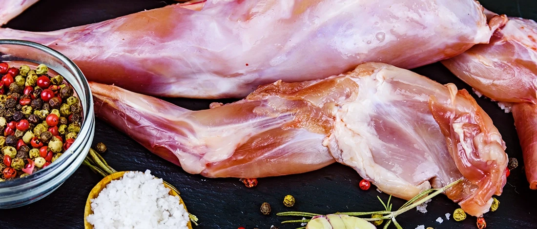 A top view of rabbit meat and spices