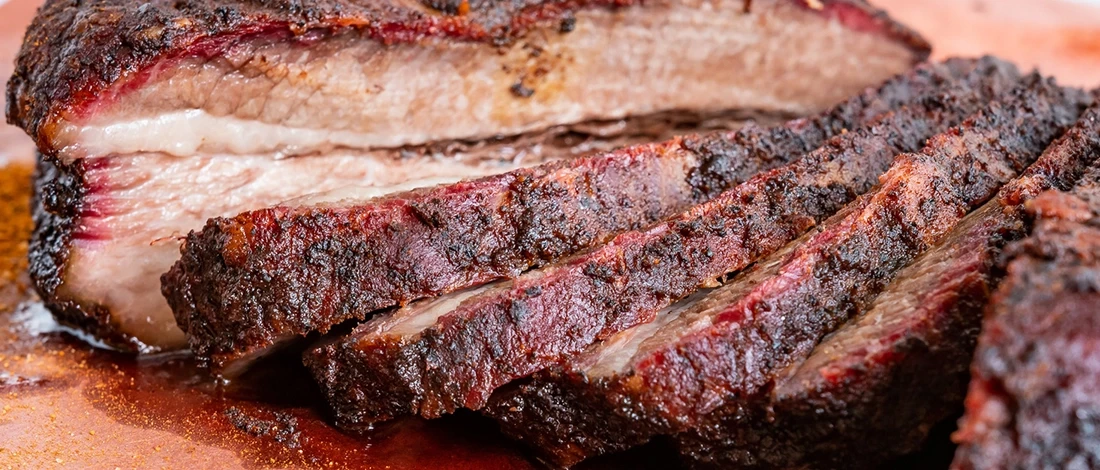 A close up shot of delicious and juicy brisket after spritzing