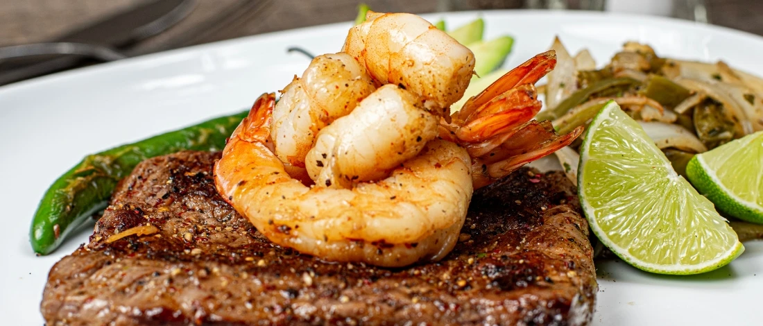 Delicious steak and shrimp on a plate